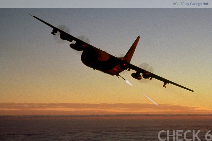 US Air Force AC-130 Spectre gunship firing its gun - by George Hall