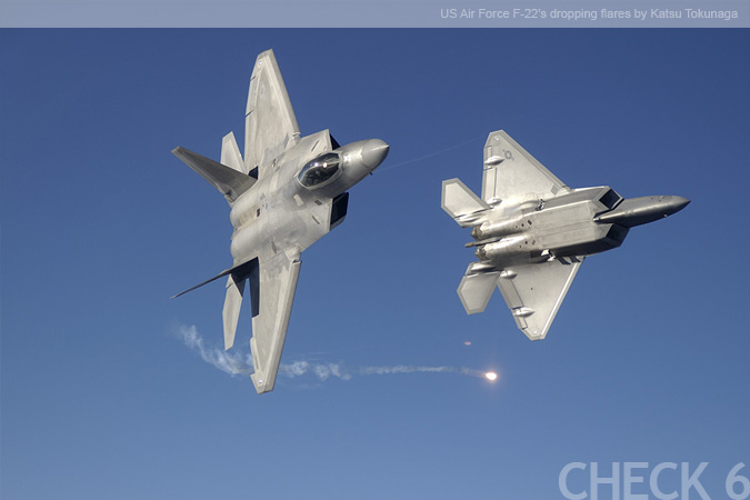 US Air Force F-22 Dropping Flares - by Katsu Tokunaga